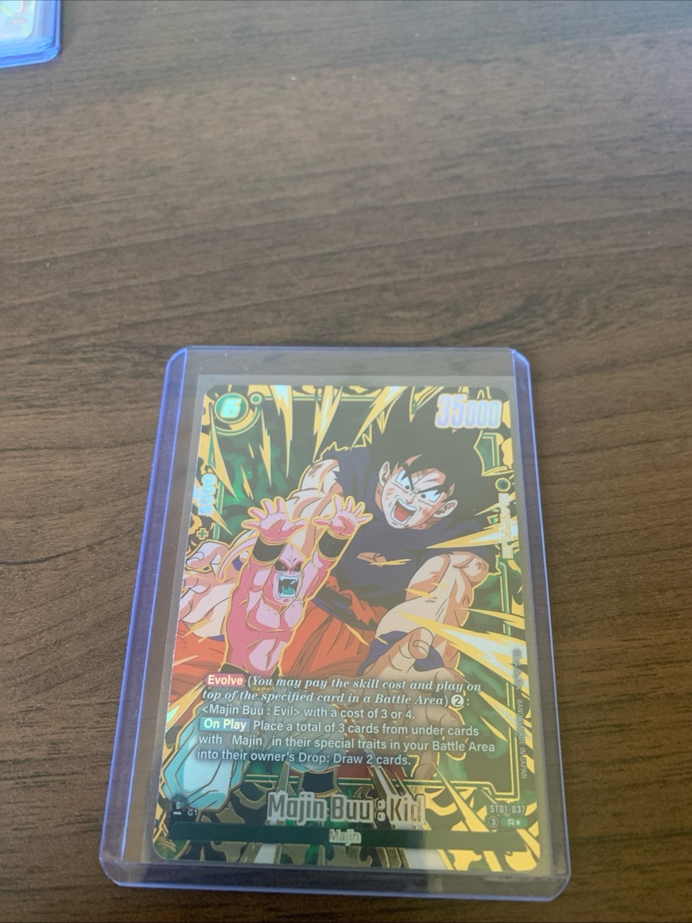 Majin Buu & Kid Goku Holographic Trading Card Sleeve — Green & Gold Artwork